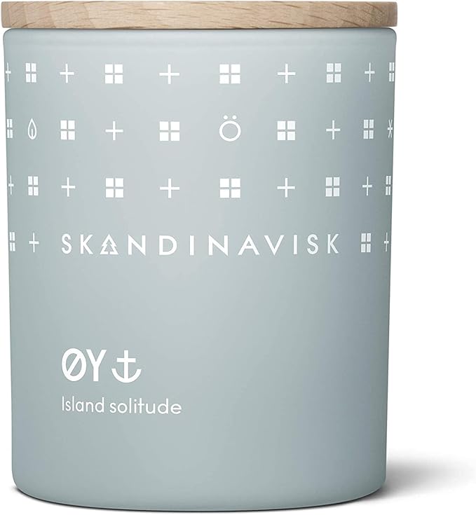 Skandinavisk ØY 'Island' Scented Candle. Fragrance Notes: Crabapple and Dog Rose, Water Mosses and Green Leaves. 7.0 oz.