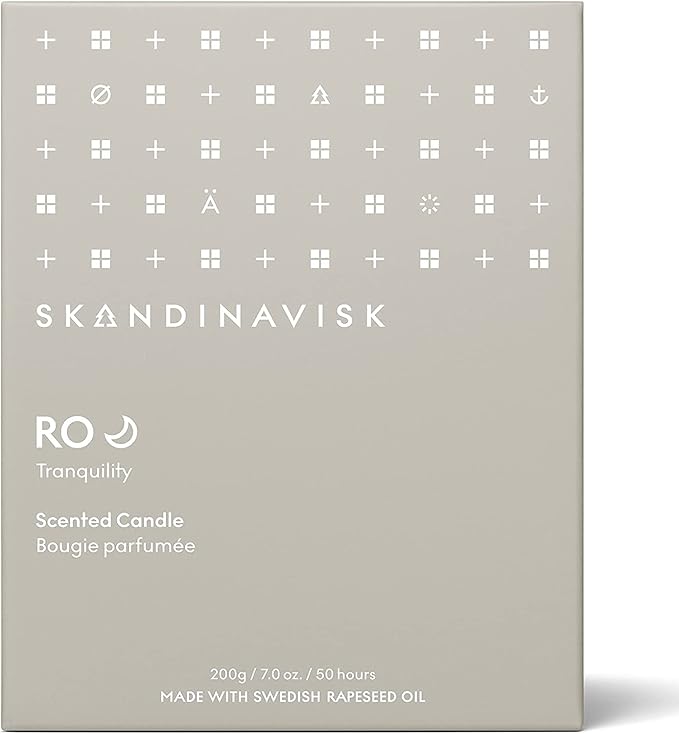 Skandinavisk RO 'Tranquility' Scented Candle. Fragrance Notes: Cut Grasses and Fallen Leaves, Cucumber and Wild Violets. 7.0 oz.
