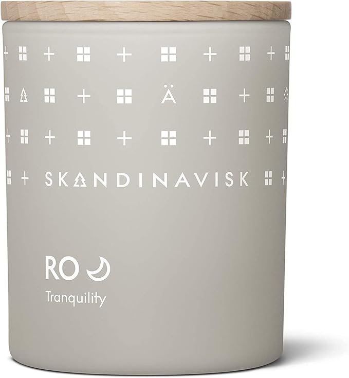 Skandinavisk RO 'Tranquility' Scented Candle. Fragrance Notes: Cut Grasses and Fallen Leaves, Cucumber and Wild Violets. 7.0 oz.