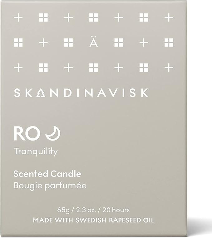 Skandinavisk RO 'Tranquility' Mini Scented Candle. Fragrance Notes: Cut Grass and Fallen Leaves, Cucumber and Wild Violets. 2.3 oz.