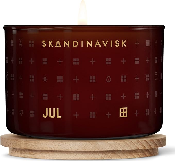 Skandinavisk JUL 'Christmas' Scented Candle. Fragrance Notes: Baked Gingerbread, Winter Cloves and Spiced Oranges. 3.17 oz.