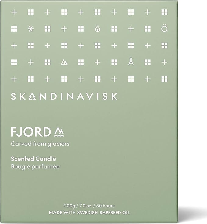 Skandinavisk Fjord Scented Candle. Fragrance Notes: Apple and Pear Blossom, Orchard Fruits and Redcurrants. 7.0 oz.