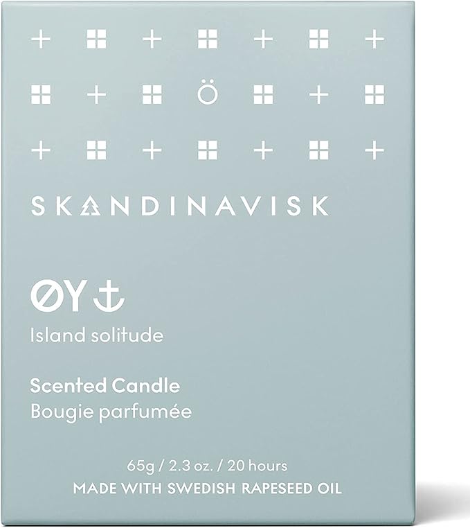 Skandinavisk ØY 'Island' Mini Scented Candle. Fragrance Notes: Crabapple and Dog Rose, Water Mosses and Green Leaves. 2.3 oz.