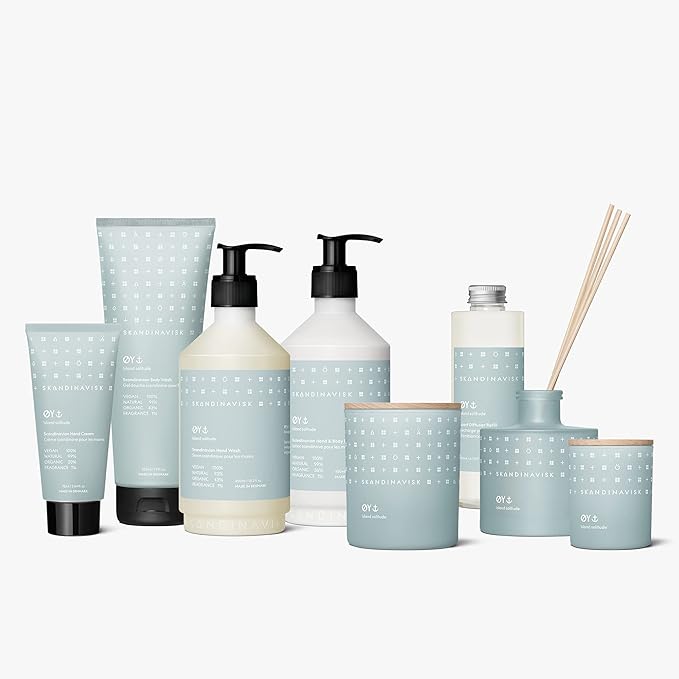 Skandinavisk ØY 'Island' Mini Scented Candle. Fragrance Notes: Crabapple and Dog Rose, Water Mosses and Green Leaves. 2.3 oz.