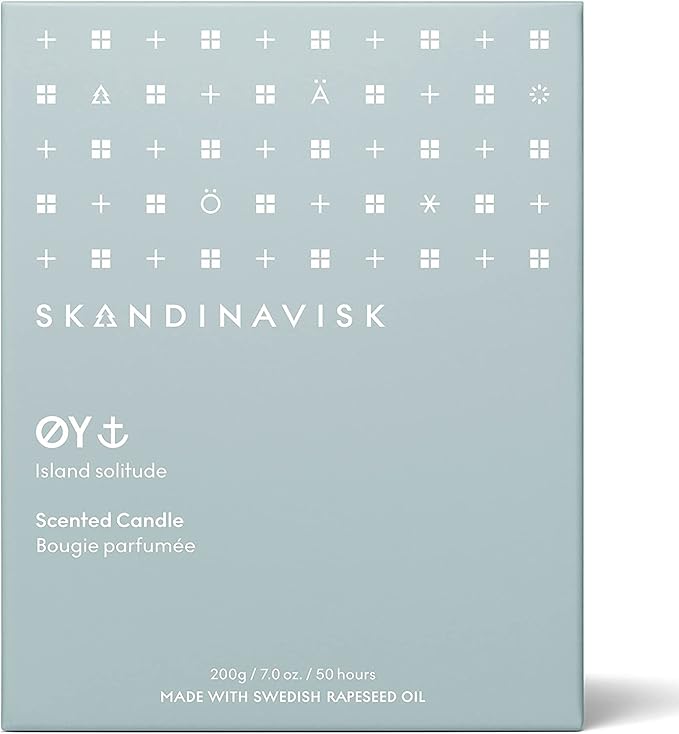 Skandinavisk ØY 'Island' Scented Candle. Fragrance Notes: Crabapple and Dog Rose, Water Mosses and Green Leaves. 7.0 oz.