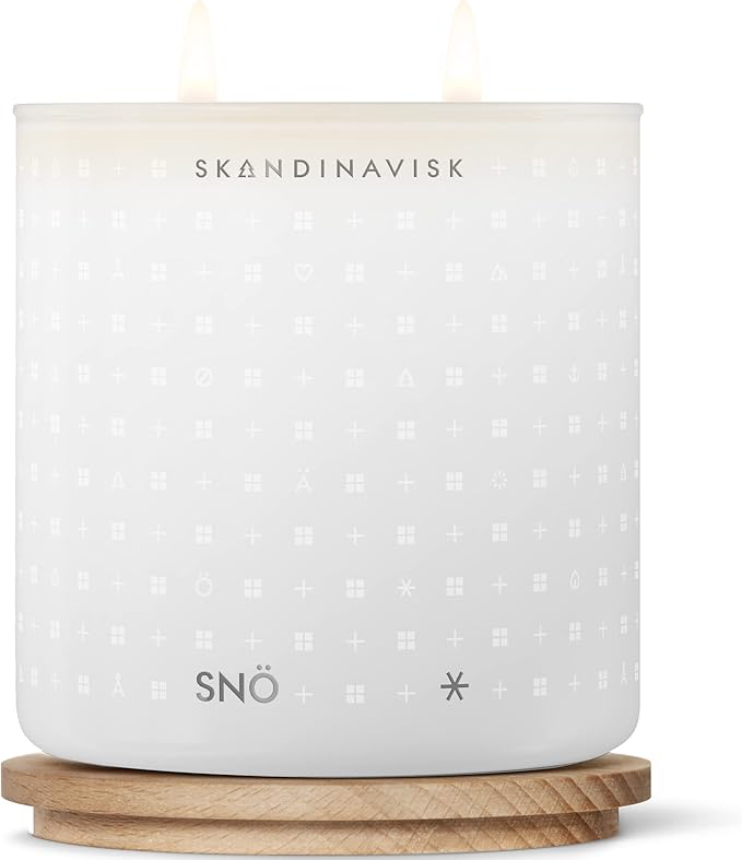 Skandinavisk SNÖ 'Snow' Scented Candle with 2 Wicks. Fragrance Notes: Frozen Forests and Frosted Berries, The Sharp Breath of Subzero Skies. 14.1 oz.