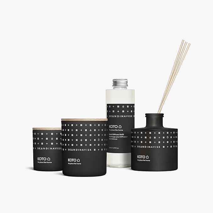 Skandinavisk KOTO 'Home' Scented Candle. Fragrance Notes: Vanilla Beans and Dried Orange Peel, Amber and Leather. 7.0 oz.