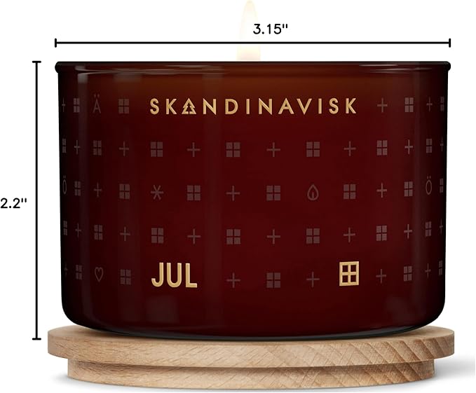 Skandinavisk JUL 'Christmas' Scented Candle. Fragrance Notes: Baked Gingerbread, Winter Cloves and Spiced Oranges. 3.17 oz.
