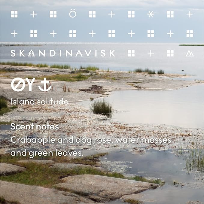 Skandinavisk ØY 'Island' Mini Scented Candle. Fragrance Notes: Crabapple and Dog Rose, Water Mosses and Green Leaves. 2.3 oz.