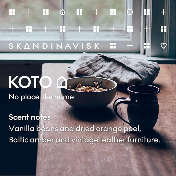 Skandinavisk KOTO 'Home' Scented Candle. Fragrance Notes: Vanilla Beans and Dried Orange Peel, Amber and Leather. 7.0 oz.