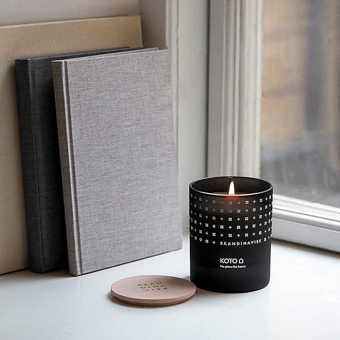Skandinavisk KOTO 'Home' Scented Candle. Fragrance Notes: Vanilla Beans and Dried Orange Peel, Amber and Leather. 7.0 oz.