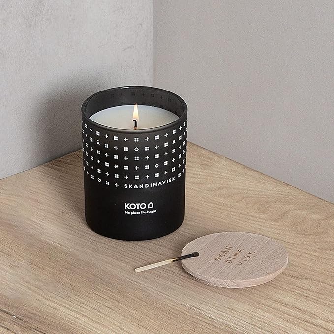 Skandinavisk KOTO 'Home' Scented Candle. Fragrance Notes: Vanilla Beans and Dried Orange Peel, Amber and Leather. 7.0 oz.