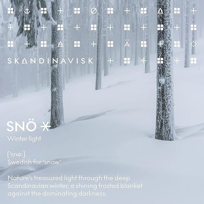 Skandinavisk SNÖ 'Snow' Scented Candle with 2 Wicks. Fragrance Notes: Frozen Forests and Frosted Berries, The Sharp Breath of Subzero Skies. 14.1 oz.