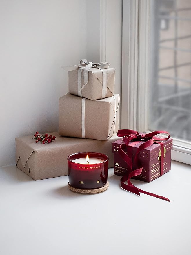 Skandinavisk JUL 'Christmas' Scented Candle. Fragrance Notes: Baked Gingerbread, Winter Cloves and Spiced Oranges. 3.17 oz.