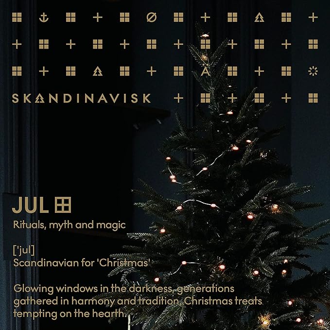 Skandinavisk JUL 'Christmas' Scented Candle. Fragrance Notes: Baked Gingerbread, Winter Cloves and Spiced Oranges. 3.17 oz.